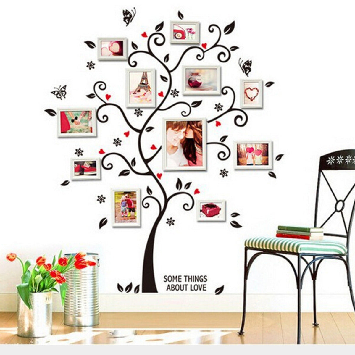 Wall decal of a decorative tree with photo frames and 'Some Things About Love' text, placed in a room with a chair and flowers.