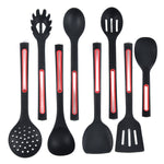 Set of black kitchen utensils with red accents on a white background